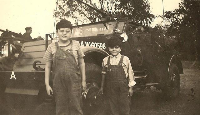 Robert and Abe Ribakoff next to a tank