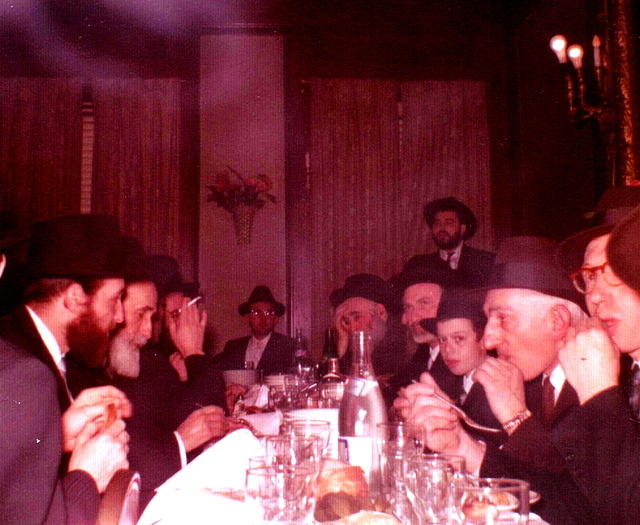 Jacob Breier center at the end of the table at his engagement party