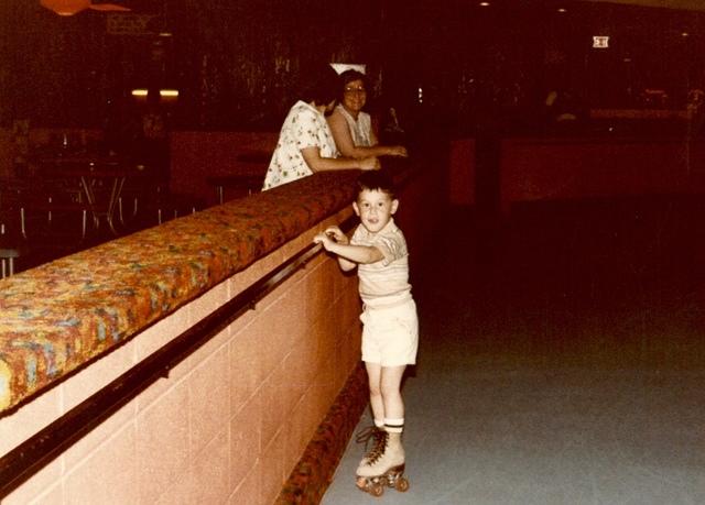 Todd Cohn at Skateland South.  Linda Cohn and Marcia Tropp in the background.