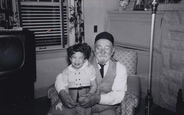 Yaakov Mechal Schulman holding Sherry Levine Krug, 1954