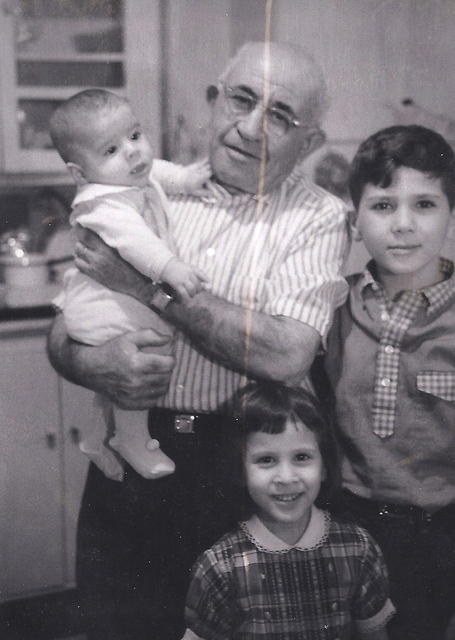 Abe Cohn holding Louis Levin with Janet Pack Levin and Lesley Levin. May 1961