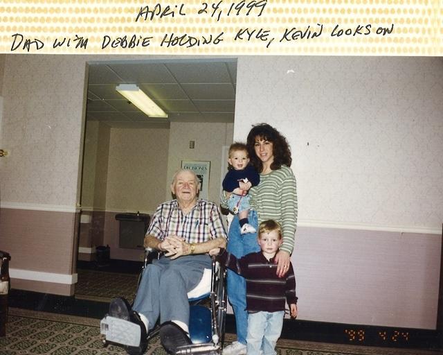 Debbie Steinlauf Irlbacker holding Kyle with David Dave Steinlauf while Kevin looks on, 1999