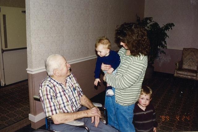 Debbie Steinlauf Irlbacker holding Kyle with David Dave Steinlauf while Kevin looks on, 1999