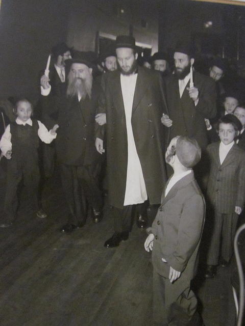 Zev Strohli being walked down the isle by Shloime Weiss