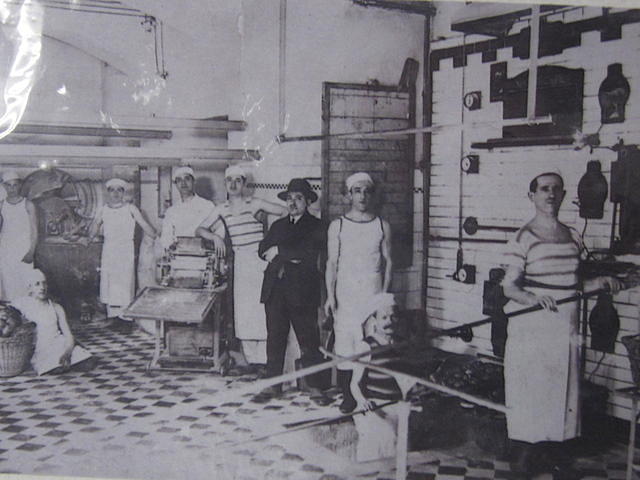 Weiss Bakery Vienna.  Center Ernest Weiss. On his left is Markus and on his right is Yisroel