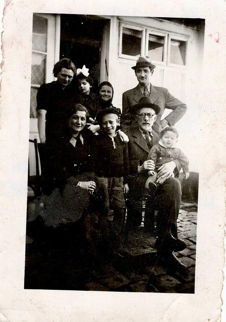 Violet Bleier Weisz, Rivka Edith Weisz, unknown, Markus Weisz, Seated L to R: Likely 2nd wife of Mordechai Bleier , Likely son of Mordechai and 2nd wife Bleier, Mordechai Bleier with his grandson Joe Weiss on his lap. Abt 1940.