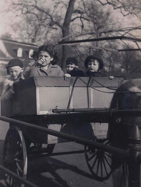 Joe Weiss and Rivka Edith Weiss w friend Arnie Gurwitz on a wagon ride in Brooklyn, NY. 1945.