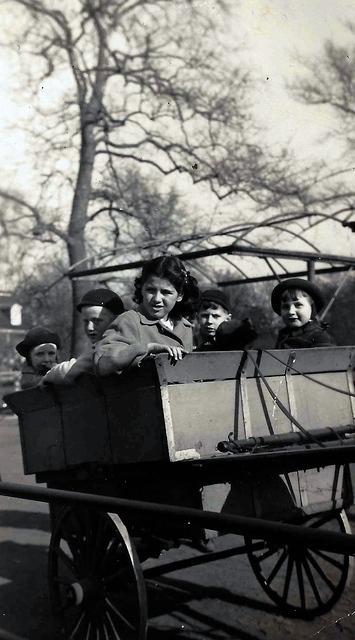 Joe Weiss and Rivka Edith Weiss w friend Arni Gurwitz on a wagon ride in Brooklyn, NY.  1945.