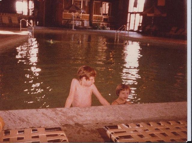 YItzi Weiss (9) and Naomi Weiss Cohn (5) swimming in Holiday Inn Pool, Wisconsin, 1982