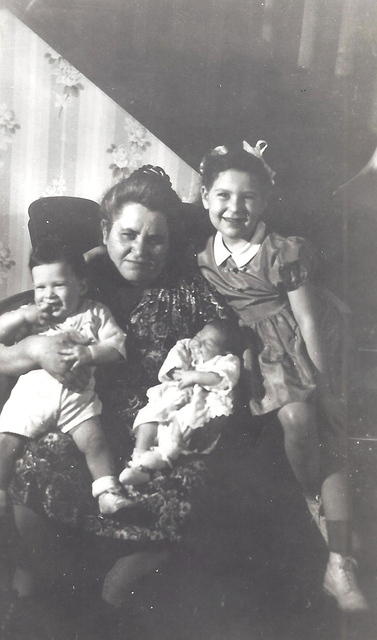 Chike Cohn Baellow with David Baellow and Merriam Baellow Sukienik on her lap, Harla Lee Baellow Loving on the right, 1951