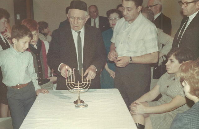 Abe Cohn lighting Chanukah candles, Jacques Choikhit, Sharon Levin Krug, Louis Cohn