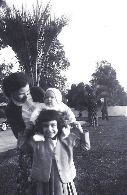 Fannie Cohn Cohen w/ Libby Cohen Needle holding baby brother Harvey on her shoulders. 1953