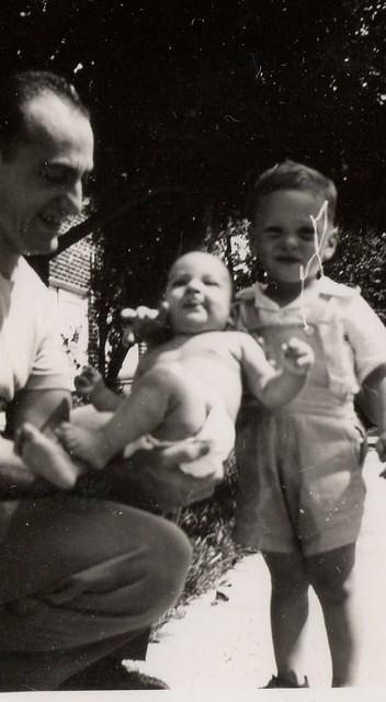 Sammy Cohen holding either Libby or Marvin - not sure which cousin is standing next to them