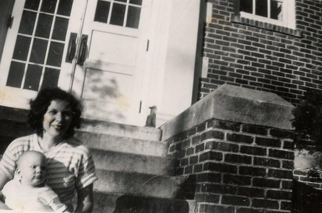 Fannie Cohn Cohen holding Harvey Cohen - steps of house on 8th Street, Jacksonville, Fl