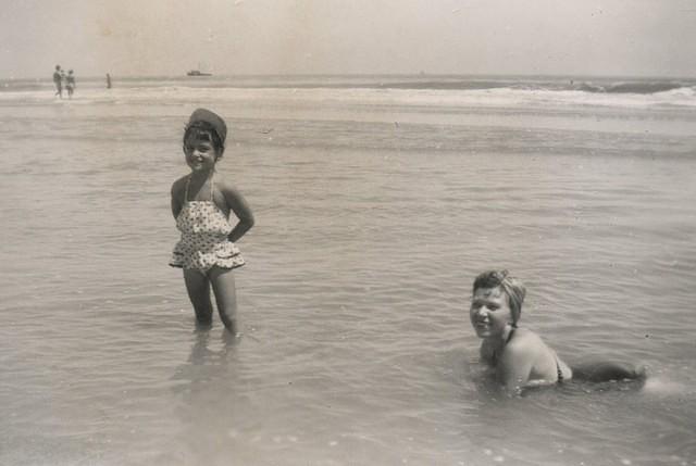 Libby Cohen Needle (standing) and her mother Fannie Cohn Cohen (in the water)