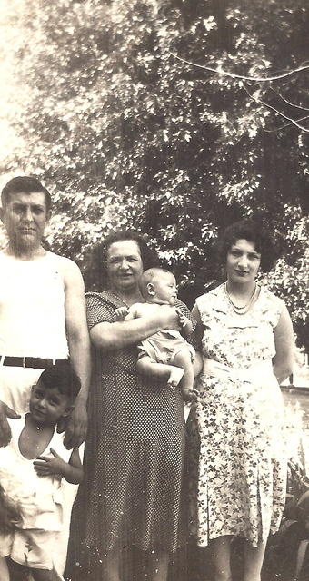 Morris (with Leon in front of him), Bala Komar Baellow (holding Norman), and Esther Baellow Levinson