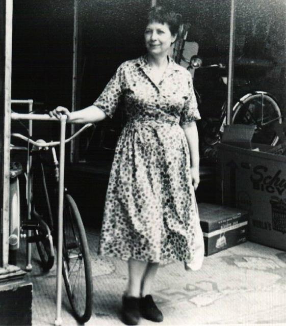 Esther Steinlauf in front of bike store