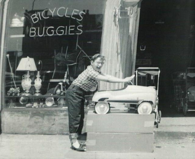 Joyce Steinlauf Corcia in front of bike store