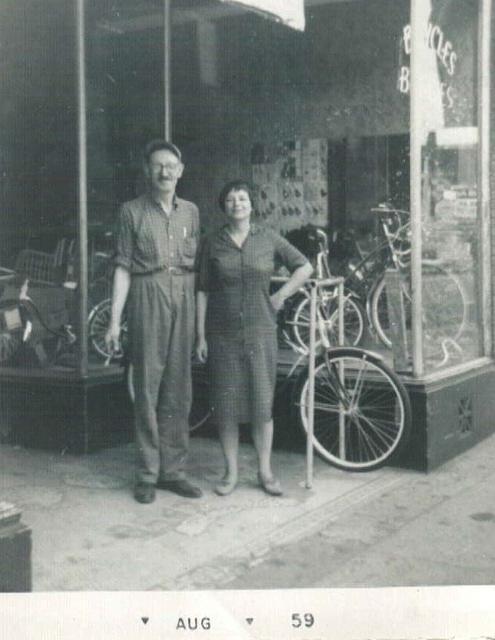 Maurice Steinlauf and Esther Yellen Steinlauf in front of the bike store