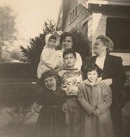 Harla Lee Baellow Loving holding Sheila Stolov, Chike Cohn Baellow, Merriam Baellow Sukiennik, David Baellow, and Beth Stolov Bayzman,