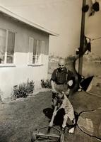 "Misha Bogart with my dad Tudor Robin “helping” mow the lawn."  See notes.