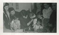 Hike Cohn Schulman holding Lori Beth Schulman at her first birthday party, Feb 4, 1957  See notes.