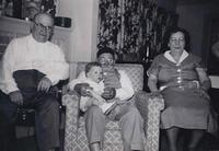 Pete Cohn, Yaakov Michel Schulman holding Joel Levine, Rose Karosen Cohn, 1954