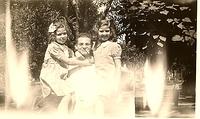 Louis Cohn holding sisters Bertie Cohn Levin and Hike Cohn Schulman, Houston, TX, 1940