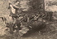 Louie Pelofsky chopping wood at the cabin in Canada