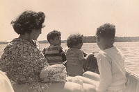 Thelma Hecht Clutz, Larry Pelofsky, Marcia Clutz Tropp, and Larry Clutz, boating at the cabin 1949