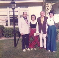 Sam & Anne Walters (friends) w Morris & Eva Tulchinsky. "In front of our house on Mercier."