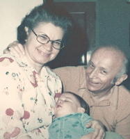 Morris and Eva Tulchinsky holding Adam Siegel