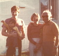 Herb Siegel holding Adam, Morris and Eva Cohn Tulchinsky