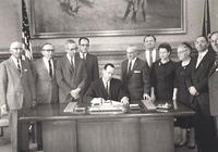 Morris Tulchinsky second to left.  Govenor Anderson signing a bill for Medicare.  1961.