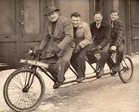 Joe, Charlie, Maurice, and Dave Steinlauf on bike